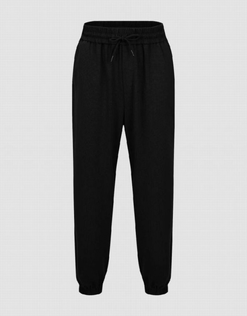 Black Urban Revivo Elastic Waist Knitted Men\'s Joggers | 40517TSGR